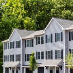 Manchester, NH residential townhouse community surrounded by fully bloomed trees and landscaped walkways