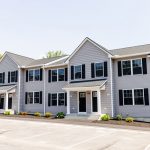 Manchester residential townhome community with attached drive-under garage and designated parking