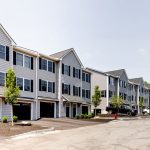 Manchester residential townhome community with attached drive-under garage and designated parking